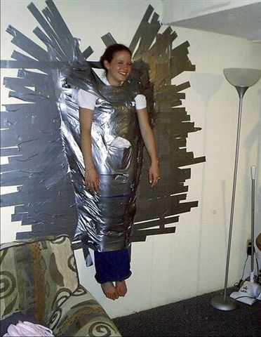[cute-girl-duct-taped-to-wall.jpg]