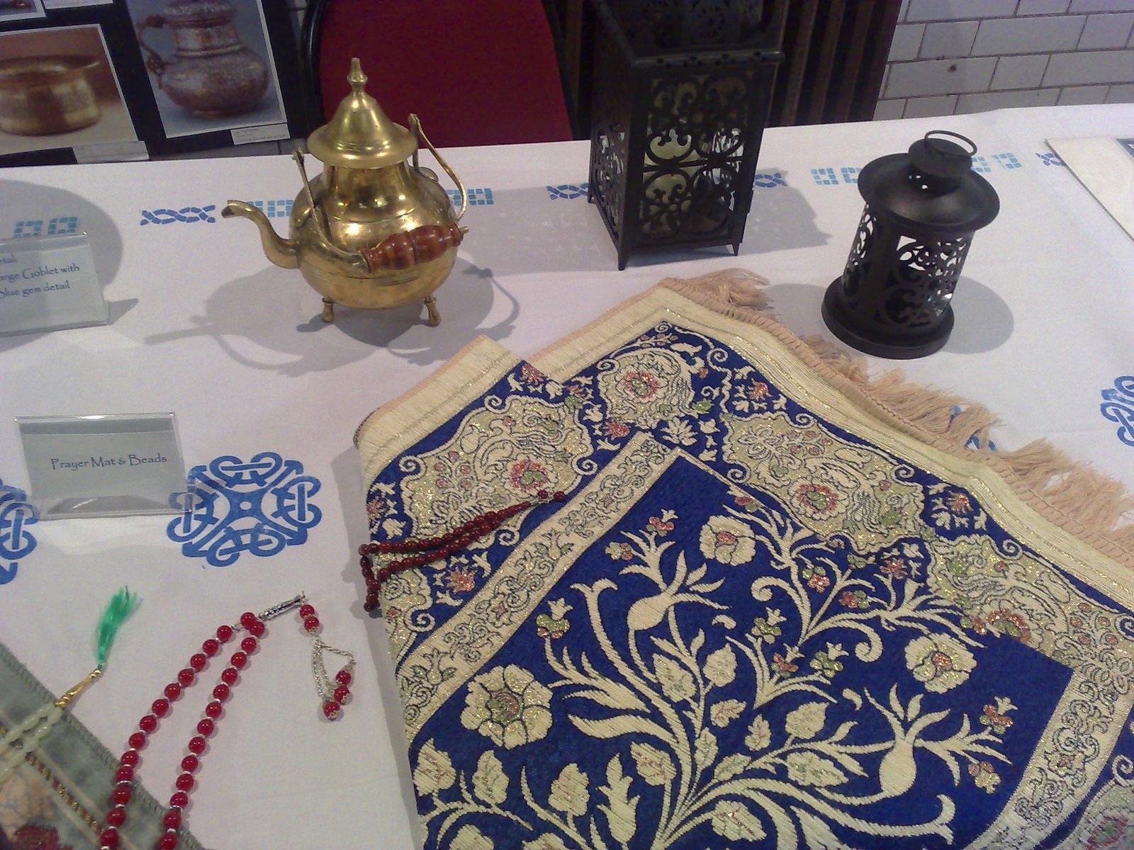 [Al-noor+prayer+mats+and+beads+display.JPG]