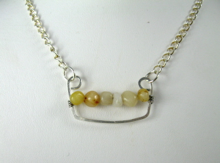 [Golden+jade+nugget+necklace+hanging.jpg]