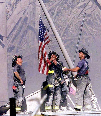 [fire-fighters-raise-american-flag-in-front-of-world-trade-center.jpg]
