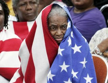 [US-flag-wrapped-around-black-women-Katrina.jpg]