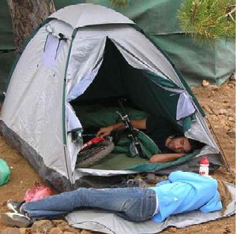 [sleeping_with_bike_in_tent.jpg]