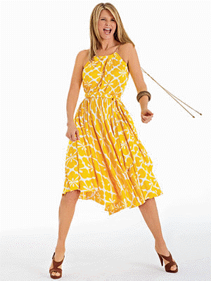 picture of Christy Brinkley wearing a yellow and white halter sun dress